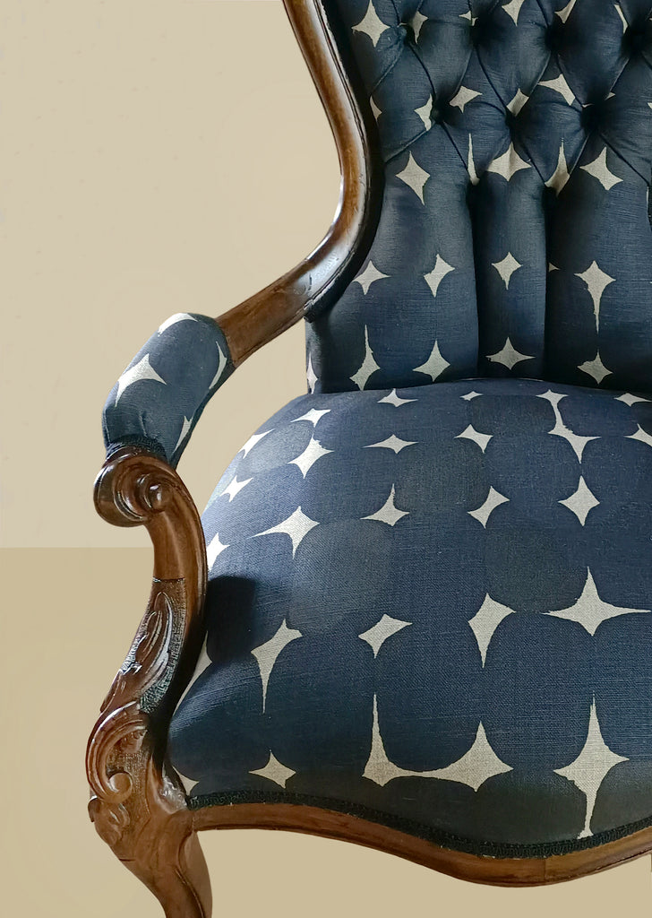 ClothFabric Stoney indigo used to upholster a classic Queen Ann armchair